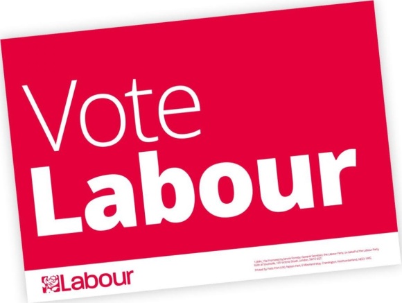 Representation of a simple poster saying vote Labour, white on red background with a Labour logo below
